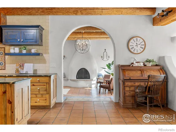 a living room with furniture and a clock