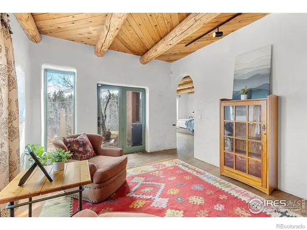 a living room with furniture and a rug