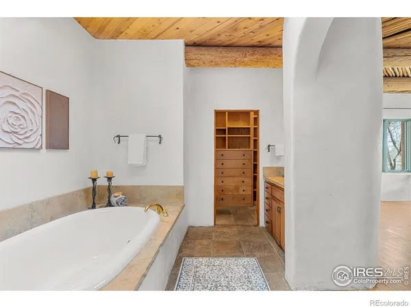 a bathroom with a bathtub and a shower