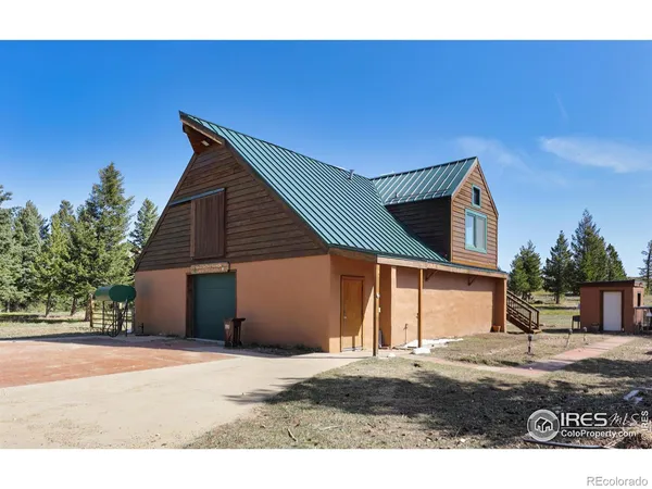 a kitchen with stainless steel appliances kitchen island granite countertop a stove and a refrigerator