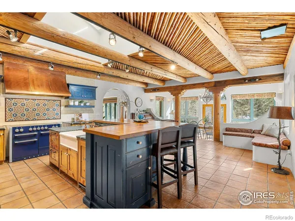 a open kitchen with stainless steel appliances granite countertop a sink and cabinets