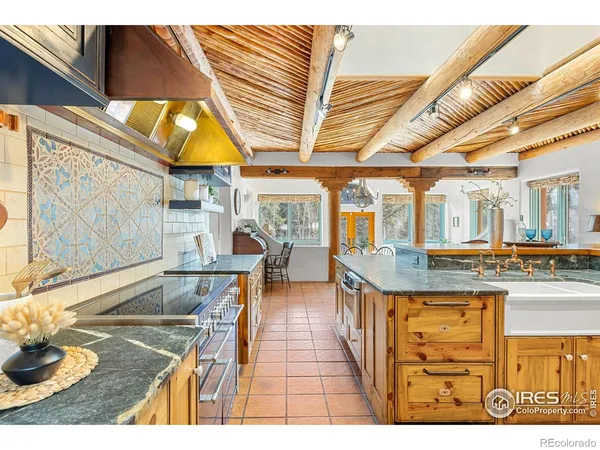 a kitchen with stove and cabinets