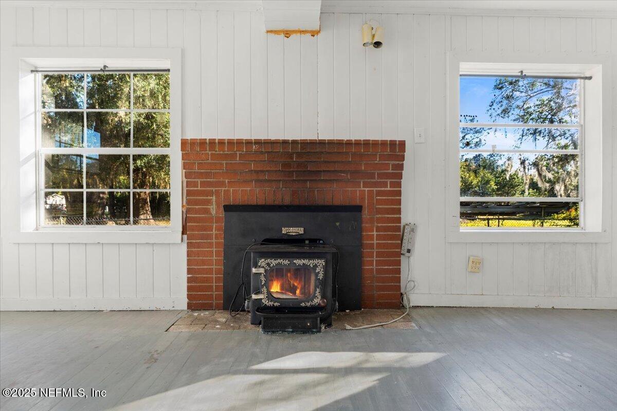 478 Harris Road Lake City, FL 32055 - Photo 11 of 43 a living room with a fireplace