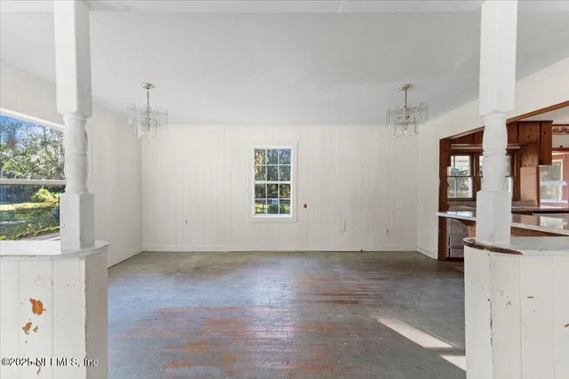 an empty room with windows