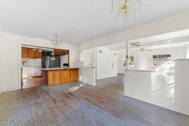 a view of kitchen with wooden floor