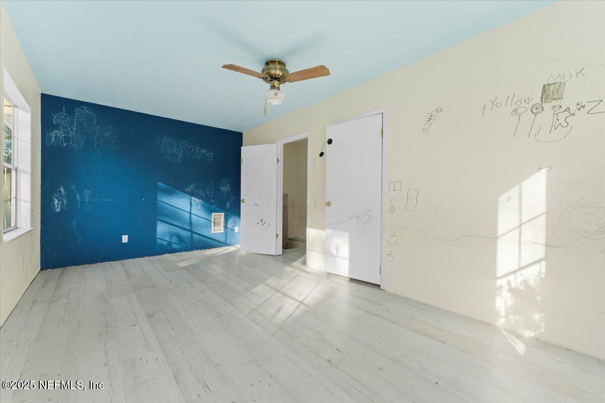 478 Harris Road Lake City, FL 32055 - Photo 18 of 43 a view of a livingroom with a ceiling fan & entryway