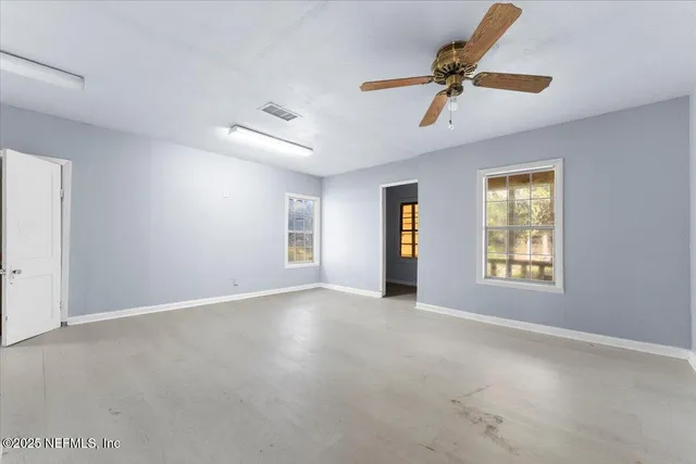 a view of an empty room with a window