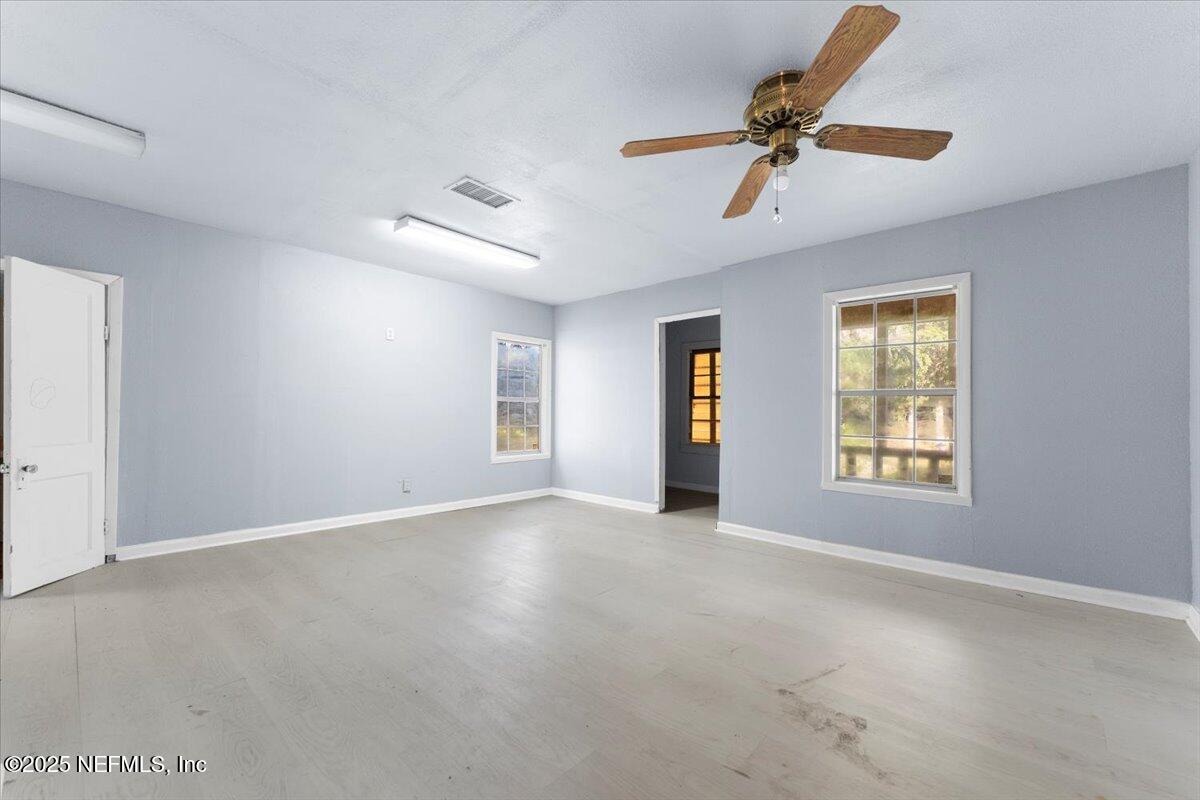 478 Harris Road Lake City, FL 32055 - Photo 22 of 43 a view of an empty room with a window