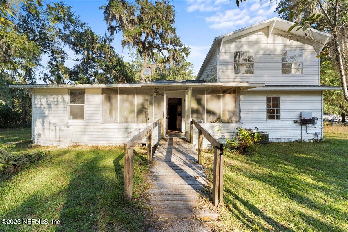 478 Harris Road Lake City, FL 32055 - Photo 33 of 43 a view of a house with backyard and sitting area