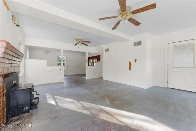 a view of livingroom with hardwood floor and a ceiling fan