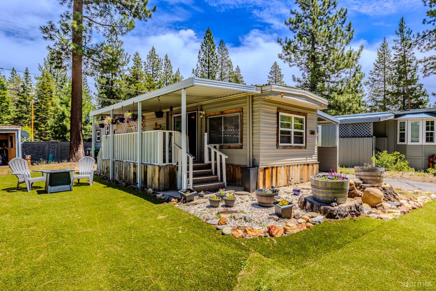 1080 Julie Lane, Unit 140 South Lake Tahoe, CA 96150 - Photo 1 of 20 a view of a house with backyard porch and sitting area
