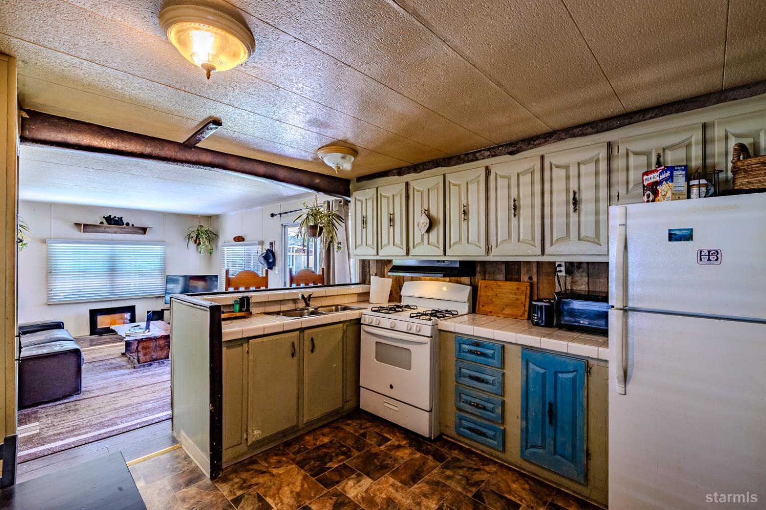 1080 Julie Lane, Unit 140 South Lake Tahoe, CA 96150 - Photo 11 of 20 a kitchen with a sink appliances and cabinets