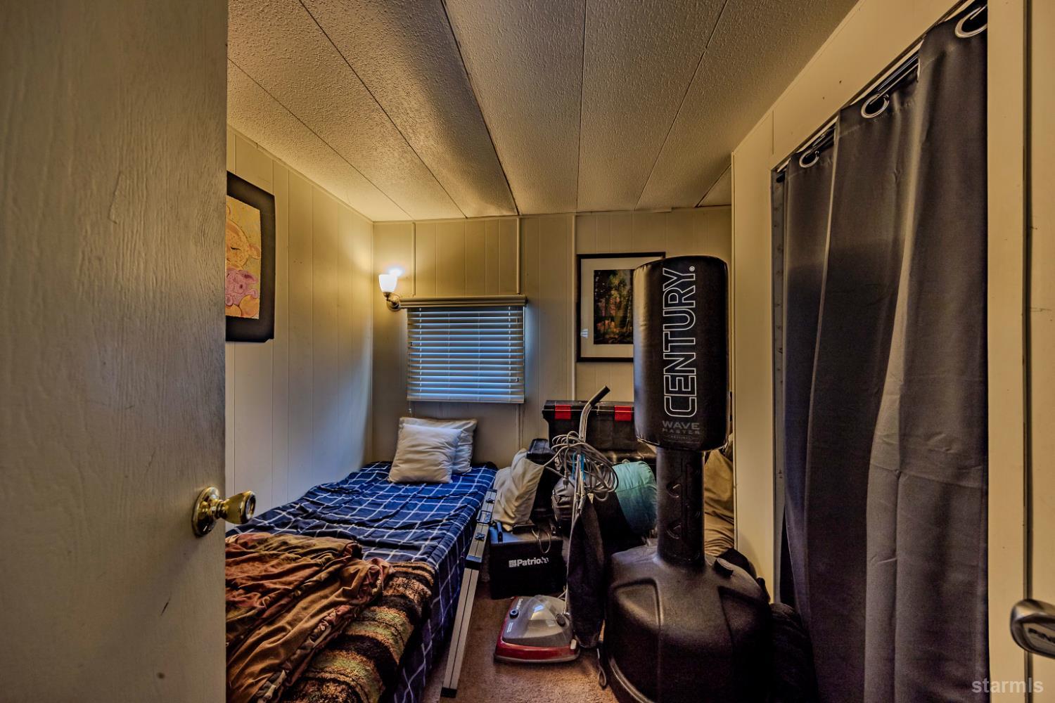 1080 Julie Lane, Unit 140 South Lake Tahoe, CA 96150 - Photo 12 of 20 a bedroom with a bed next to a window