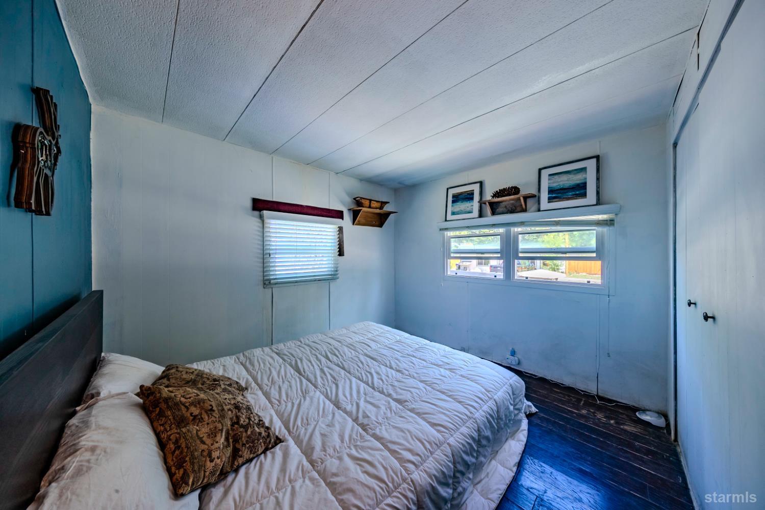 1080 Julie Lane, Unit 140 South Lake Tahoe, CA 96150 - Photo 13 of 20 a bedroom with bed and a window