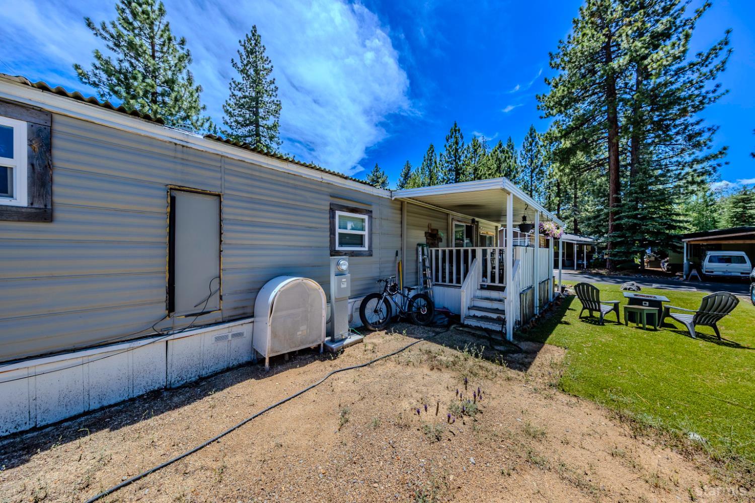 1080 Julie Lane, Unit 140 South Lake Tahoe, CA 96150 - Photo 15 of 20 a view of a patio with a table chairs and a fire pit