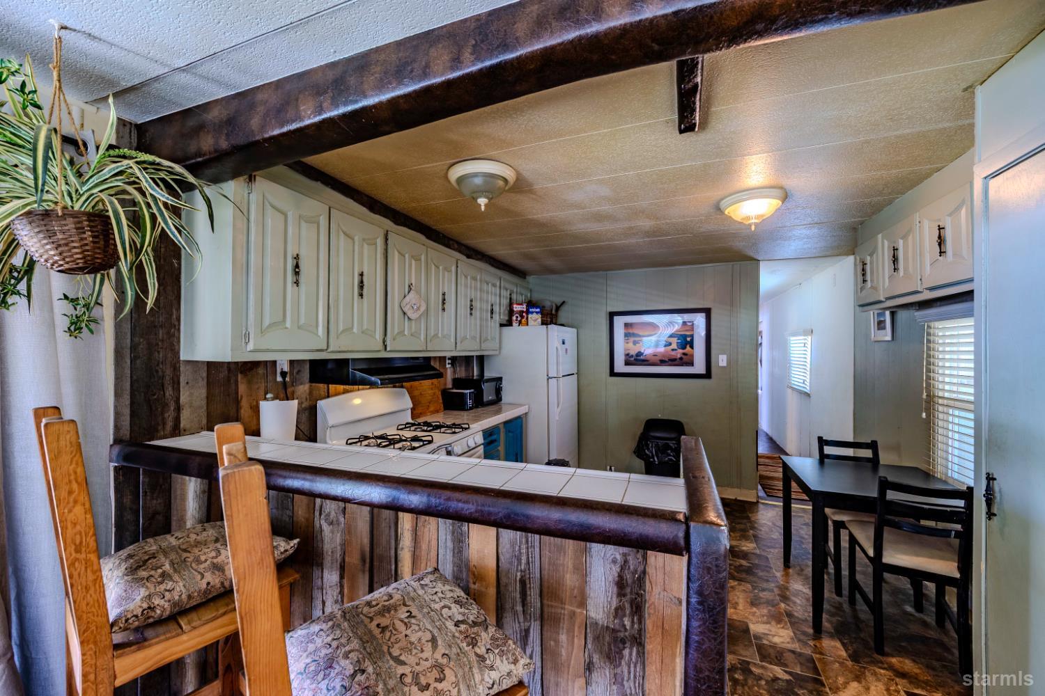 1080 Julie Lane, Unit 140 South Lake Tahoe, CA 96150 - Photo 10 of 20 a view of kitchen with furniture and a window