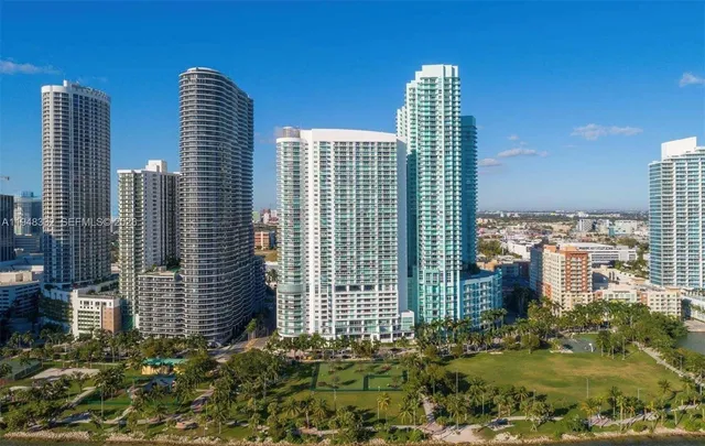 a view of a city with tall buildings