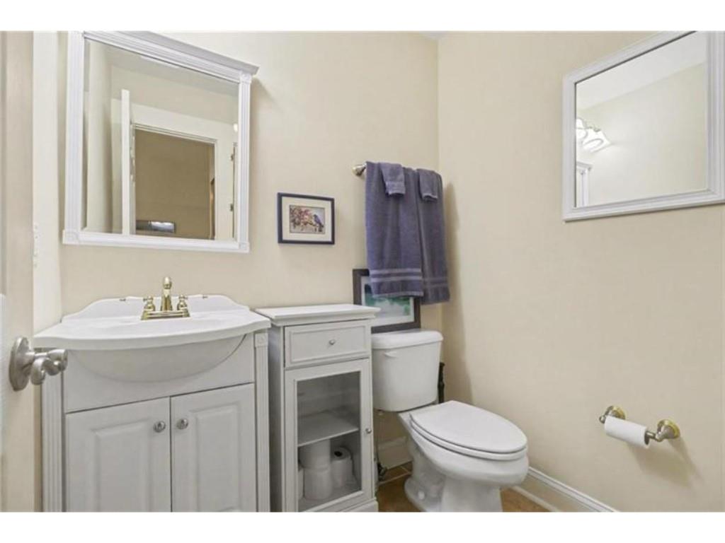53 Pinto Place Jasper, GA 30143 - Photo 44 of 62 a bathroom with a toilet a sink a mirror and vanity