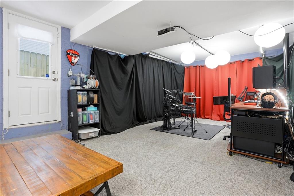 1430 Thomas Road Decatur, GA 30030 - Photo 26 of 42 a room with gym equipment and a mirror