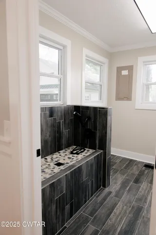 a view of wooden floor and a window