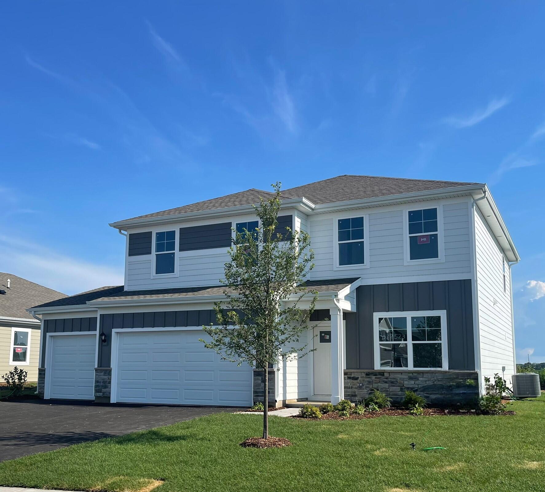 7347 West 107th Place Crown Point, IN 46307 - Photo 2 of 26 a front view of house with a garden
