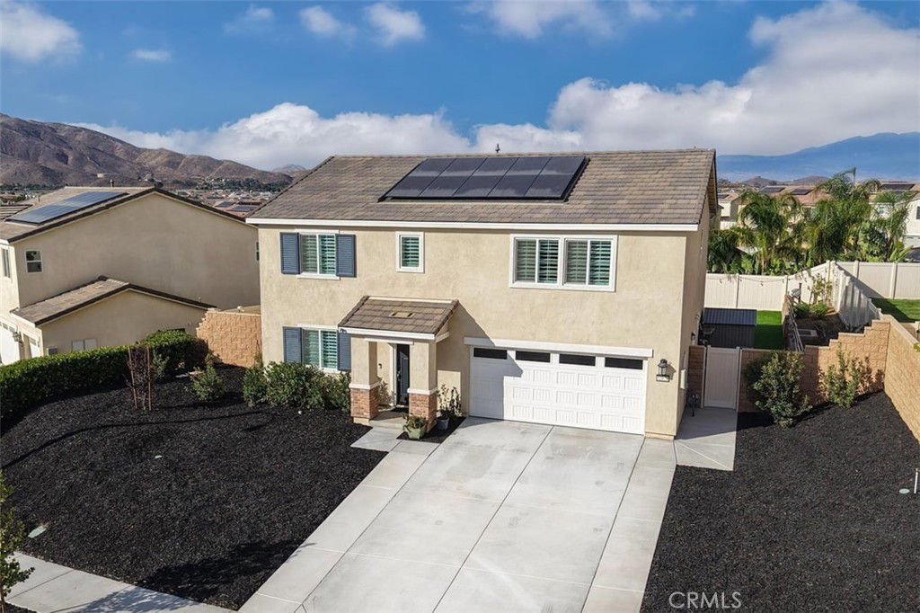 32078 Rambling Court Winchester, CA 92596 - Photo 3 of 48 a front view of a house with a yard