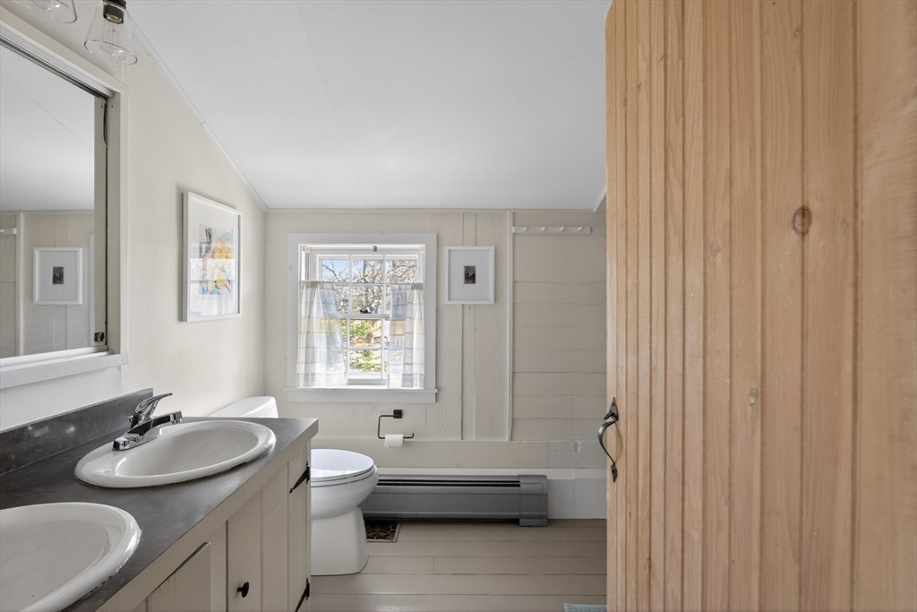 7 Pip'n Road Edgartown, MA 02539 - Photo 17 of 41 a bathroom with a double vanity sink toilet and a tub