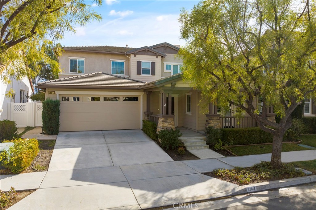 28817 Edenton Way Temecula, CA 92591 - Photo 3 of 56 a front view of a house with a garden