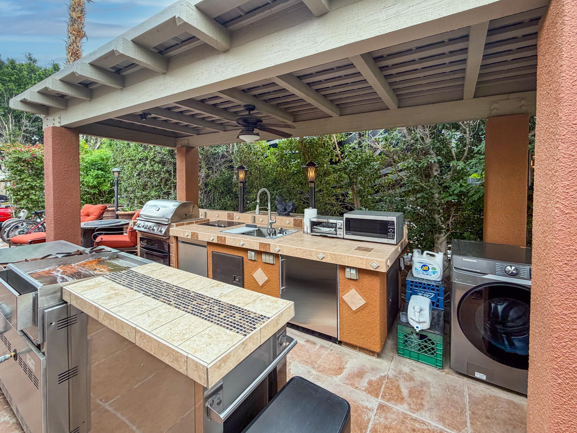 80394 Ave 48, Unit 281 Indio, CA 92201 - Photo 13 of 15 a view of a kitchen with a stove and a grill