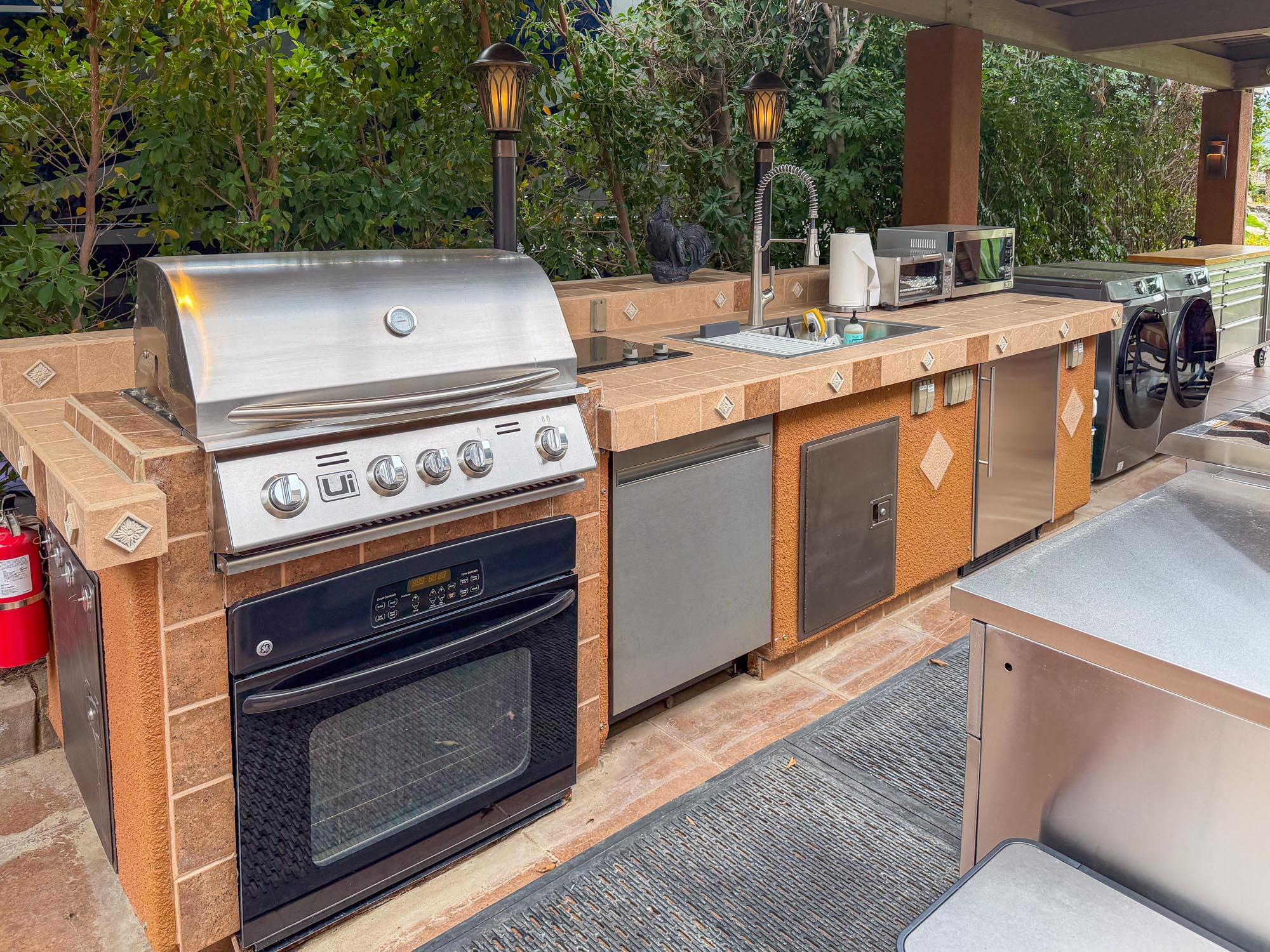 80394 Ave 48, Unit 281 Indio, CA 92201 - Photo 3 of 15 a open kitchen with a stove and a microwave