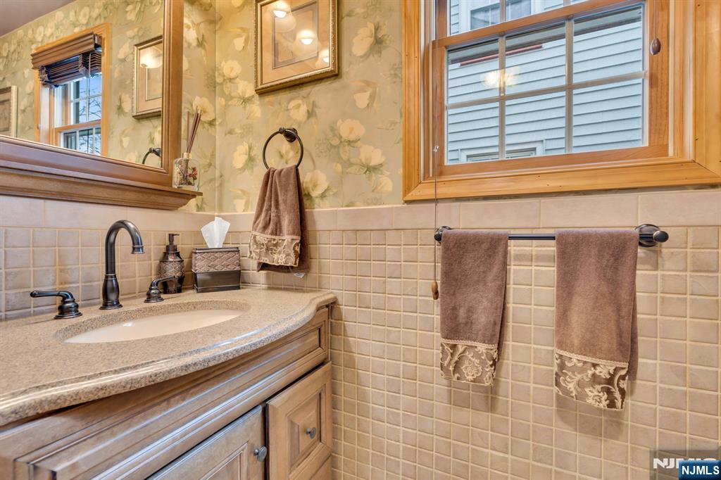 104 Prospect Street Nutley, NJ 07110 - Photo 18 of 41 a bathroom with a sink and a mirror