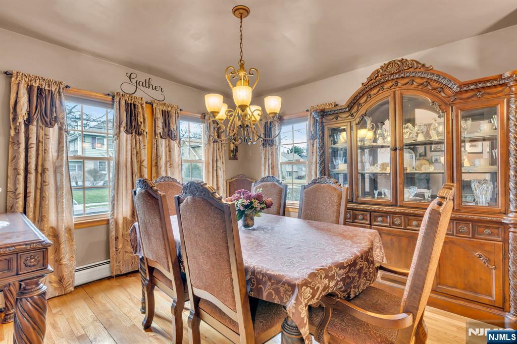 104 Prospect Street Nutley, NJ 07110 - Photo 19 of 41 a view of a dining room with furniture window and wooden floor