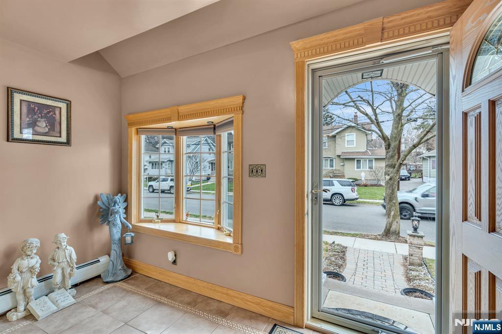 104 Prospect Street Nutley, NJ 07110 - Photo 3 of 41 a living room with furniture and a window