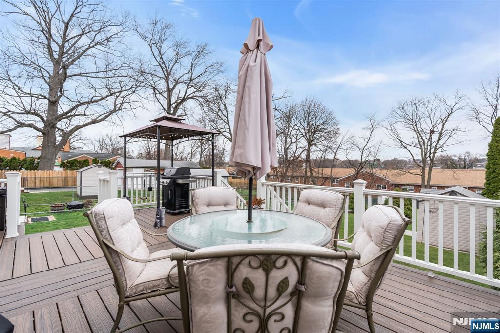 104 Prospect Street Nutley, NJ 07110 - Photo 35 of 41 a patio with a patio table and chairs