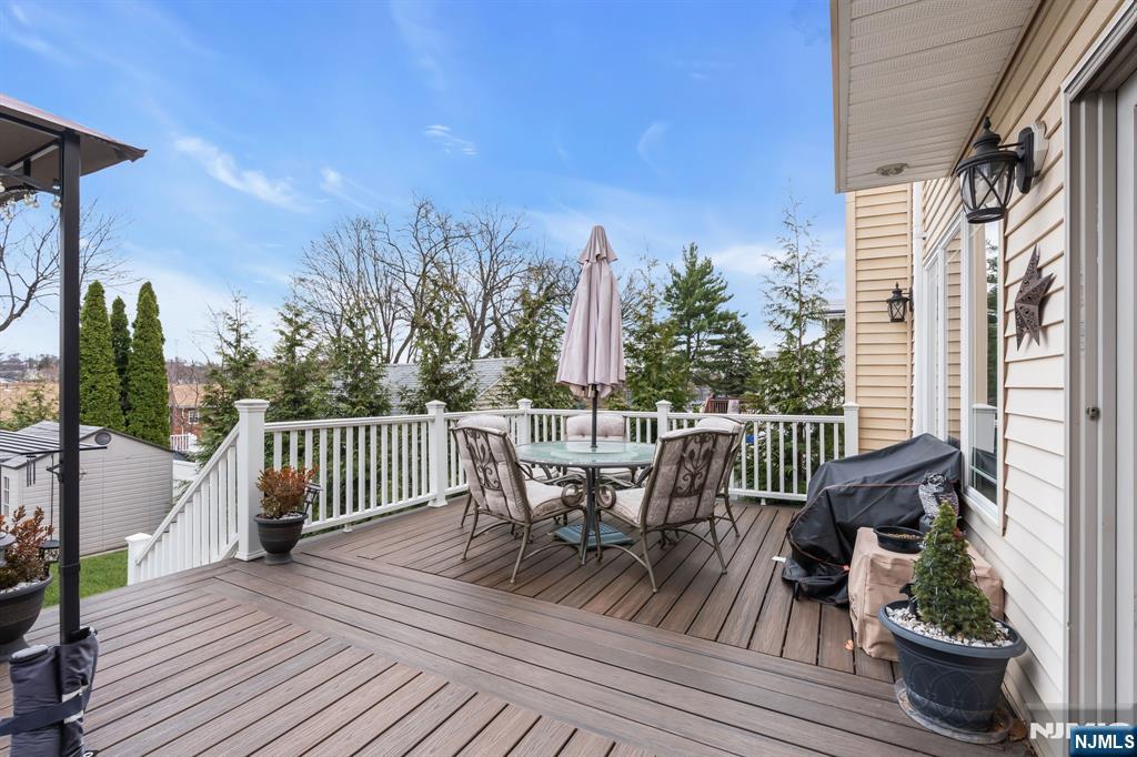 104 Prospect Street Nutley, NJ 07110 - Photo 36 of 41 a view of a deck with furniture and wooden floor