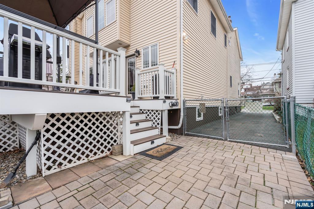 104 Prospect Street Nutley, NJ 07110 - Photo 37 of 41 a view of a patio with table and chairs