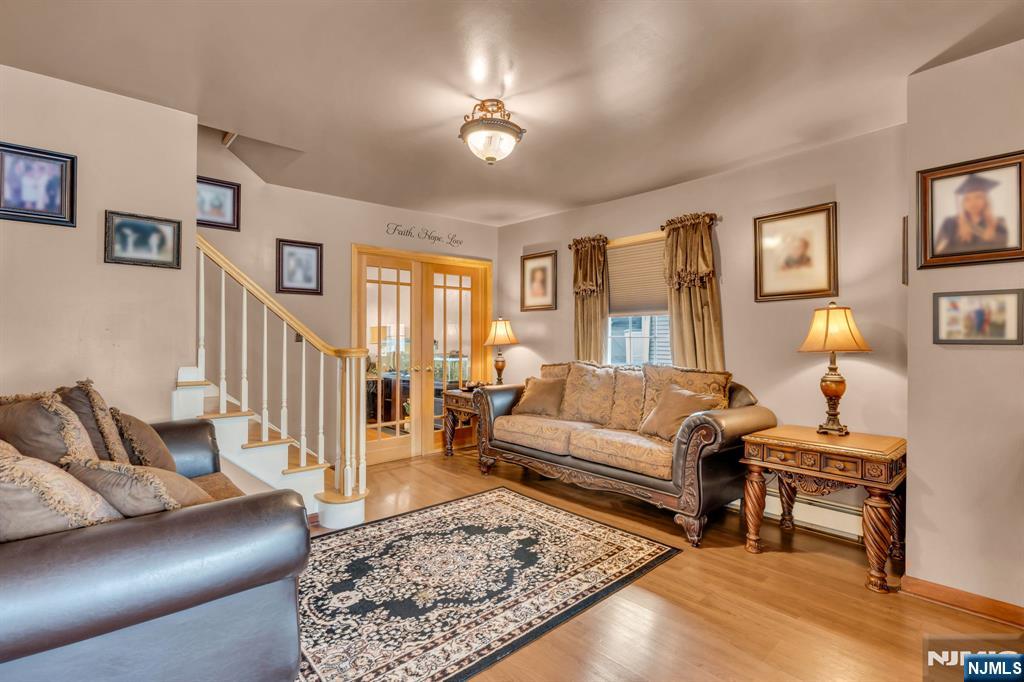 104 Prospect Street Nutley, NJ 07110 - Photo 6 of 41 a living room with furniture and a rug