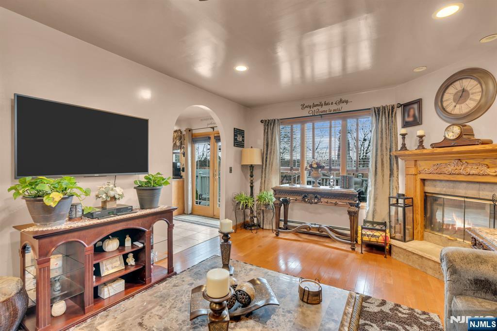 104 Prospect Street Nutley, NJ 07110 - Photo 8 of 41 a living room with furniture and a flat screen tv