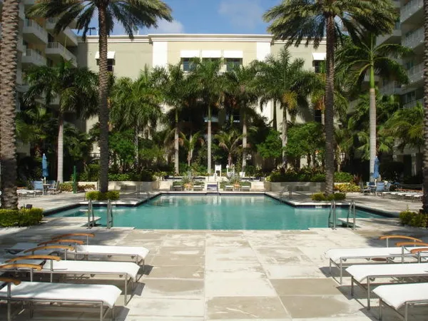 a living room with furniture and a mirror