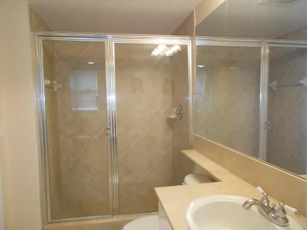 a bathroom with a shower and a toilet