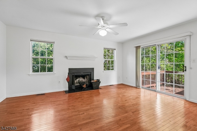 1 Leigh Road Hillsborough, NJ 08844 - Photo 15 of 35 a view of an empty room with window and wooden floor