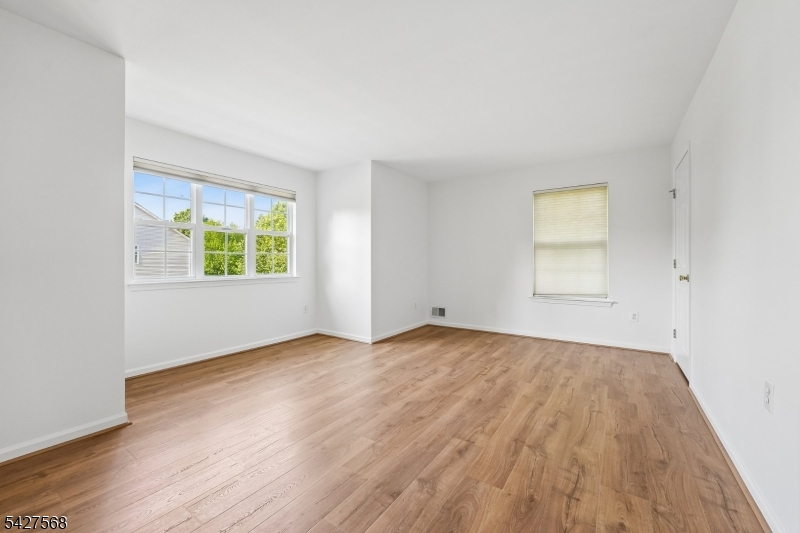 1 Leigh Road Hillsborough, NJ 08844 - Photo 19 of 35 an empty room with wooden floor and windows
