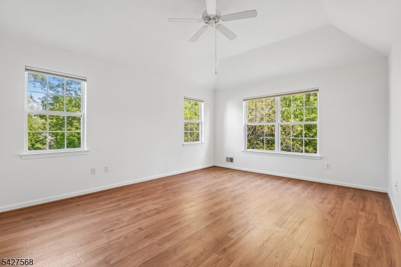 1 Leigh Road Hillsborough, NJ 08844 - Photo 21 of 35 a view of an empty room with wooden floor and a window