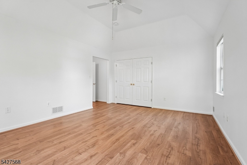 1 Leigh Road Hillsborough, NJ 08844 - Photo 22 of 35 a view of an empty room with wooden floor