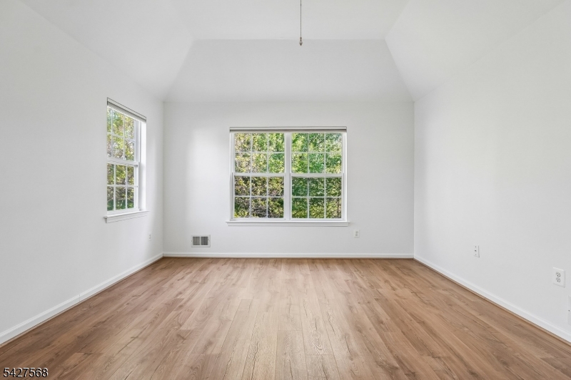 1 Leigh Road Hillsborough, NJ 08844 - Photo 23 of 35 an empty room with wooden floor and windows
