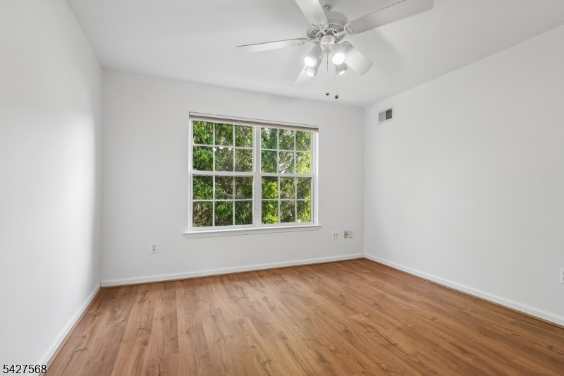 1 Leigh Road Hillsborough, NJ 08844 - Photo 27 of 35 an empty room with wooden floor and windows