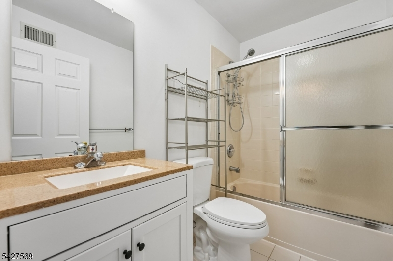 1 Leigh Road Hillsborough, NJ 08844 - Photo 29 of 35 a bathroom with a sink toilet and shower