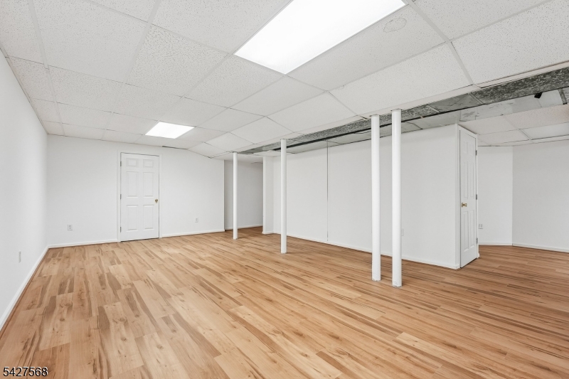 1 Leigh Road Hillsborough, NJ 08844 - Photo 33 of 35 a view of an empty room with wooden floor