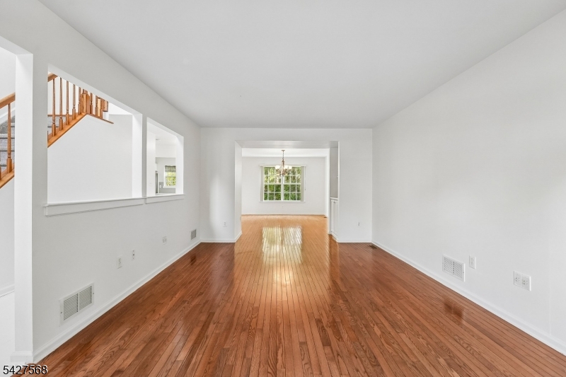 1 Leigh Road Hillsborough, NJ 08844 - Photo 6 of 35 an empty room with wooden floor and windows