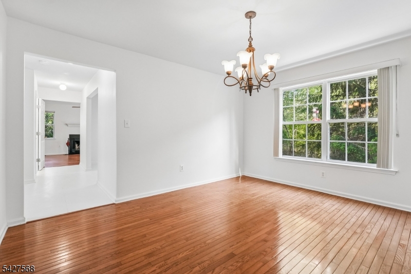 1 Leigh Road Hillsborough, NJ 08844 - Photo 10 of 35 a view of a room with wooden floor chandelier and a window